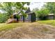 Charming home with green siding, brick foundation, and a covered porch, nestled in a serene outdoor setting at 3547 Willowood Pond Dr, Rock Hill, SC 29730