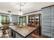 Well-designed kitchen featuring an island, stainless steel appliances, and shaker-style cabinets with wooden accents at 3547 Willowood Pond Dr, Rock Hill, SC 29730