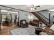 Open-concept living area flowing into the dining room and a wooden staircase with hardwood floors and natural light at 3547 Willowood Pond Dr, Rock Hill, SC 29730