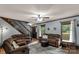 Comfortable living room with plush seating, a ceiling fan, and views of the front yard with natural light at 3547 Willowood Pond Dr, Rock Hill, SC 29730