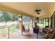 Relaxing screened porch with ceiling fans and backyard views at 3547 Willowood Pond Dr, Rock Hill, SC 29730