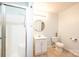 Cozy bathroom featuring a new shower, tile flooring, and a round mirror at 4010 Carlton Dr, Claremont, NC 28610