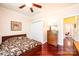 Bedroom features a ceiling fan, hardwood floors, and double door closet at 4010 Carlton Dr, Claremont, NC 28610