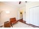 Bedroom features hardwood floors, a ceiling fan, and a modern styled leather sofa at 4010 Carlton Dr, Claremont, NC 28610