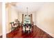 Formal dining room with dark wood floors, a modern light fixture and large windows at 4010 Carlton Dr, Claremont, NC 28610