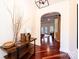 Elegant foyer with hardwood floors, arched doorway, stylish console table, and open view to the living area at 4010 Carlton Dr, Claremont, NC 28610