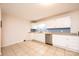 Spacious kitchen with stainless steel appliances, white cabinets, and tile flooring at 4010 Carlton Dr, Claremont, NC 28610