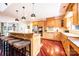 Spacious kitchen with a large island, granite countertops, stainless steel appliances, and wood floors at 4010 Carlton Dr, Claremont, NC 28610