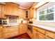 A close-up view of the kitchen showing stainless steel appliances and wooden cabinets at 4010 Carlton Dr, Claremont, NC 28610