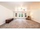 Inviting living room features French doors, plush carpeting, and a cozy seating area at 4010 Carlton Dr, Claremont, NC 28610