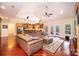 Spacious living room with a vaulted ceiling, hardwood floors, comfortable leather seating, and an open layout at 4010 Carlton Dr, Claremont, NC 28610