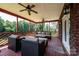Spacious covered porch with comfortable seating, ideal for outdoor relaxation at 4010 Carlton Dr, Claremont, NC 28610