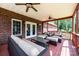 Covered back porch with outdoor seating, ceiling fans, and access to the backyard at 4010 Carlton Dr, Claremont, NC 28610