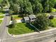 Overhead view of the property highlighting its manicured lawn, mature trees, and convenient street access at 4101 Tipperary Pl, Charlotte, NC 28215