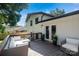 Cozy back deck with stylish outdoor seating and access to the home's interior via double doors at 4101 Tipperary Pl, Charlotte, NC 28215