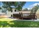 Backyard view featuring a spacious deck and an inviting outdoor entertaining area at 4101 Tipperary Pl, Charlotte, NC 28215