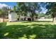 Expansive backyard with a well-manicured lawn and a privacy fence, perfect for outdoor activities at 4101 Tipperary Pl, Charlotte, NC 28215