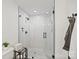 Modern bathroom with a spacious glass-enclosed shower featuring white tile and black hardware at 4101 Tipperary Pl, Charlotte, NC 28215