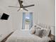 Bedroom with a ceiling fan, a large window with curtains, and a comfortable bed at 4101 Tipperary Pl, Charlotte, NC 28215