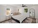 Bright bedroom with large windows, ceiling fan, dark wood floor, and neutral decor at 4101 Tipperary Pl, Charlotte, NC 28215