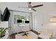 Bright home office featuring a large window, a white desk, and a ceiling fan at 4101 Tipperary Pl, Charlotte, NC 28215