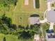 Aerial view of property highlighting backyard, patio area, and surrounding landscaping at 4535 Falls Lake Sw Dr, Concord, NC 28025