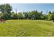 Expansive backyard with mature trees and grass. Including a playset at 4535 Falls Lake Sw Dr, Concord, NC 28025