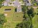 Aerial view of backyard with pond, play area, and privacy fence at 4535 Falls Lake Sw Dr, Concord, NC 28025