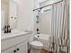 Well-lit bathroom featuring a shower-tub combo, a vanity with storage, and modern fixtures at 4535 Falls Lake Sw Dr, Concord, NC 28025