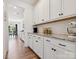 Bright kitchen with white cabinets, granite countertops, and stainless steel appliances at 4535 Falls Lake Sw Dr, Concord, NC 28025