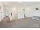 Open second floor landing with neutral carpet, closet, and entryways to various rooms at 4535 Falls Lake Sw Dr, Concord, NC 28025