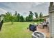 Large, well-maintained backyard with lush green grass, mature trees, and an inviting patio area at 505 Silers Bald Dr, Fort Mill, SC 29715