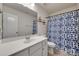 Bathroom featuring a wide vanity, blue patterned shower curtain, and a large mirror at 505 Silers Bald Dr, Fort Mill, SC 29715