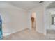 Bright bedroom with neutral carpet and walls, featuring a walk-in closet and doorway at 505 Silers Bald Dr, Fort Mill, SC 29715