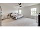 Bright bedroom with ample natural light, a ceiling fan, and neutral-toned carpet and walls at 505 Silers Bald Dr, Fort Mill, SC 29715