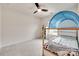 Well-lit bedroom with a ceiling fan, bunk bed, and storage shelves next to a window at 505 Silers Bald Dr, Fort Mill, SC 29715