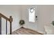 Bright entryway with wood flooring, decorative wreath, and modern door design at 505 Silers Bald Dr, Fort Mill, SC 29715