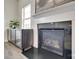 Elegant fireplace with modern glass doors and decorative mantel at 505 Silers Bald Dr, Fort Mill, SC 29715