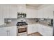 Kitchen featuring stainless steel appliances, white cabinets, and granite countertops at 505 Silers Bald Dr, Fort Mill, SC 29715