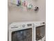 Functional laundry room featuring modern washer, dryer, and storage shelving for convenience at 505 Silers Bald Dr, Fort Mill, SC 29715