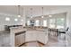 The kitchen sink overlooks a dining room area with large windows and an adjacent living room at 505 Silers Bald Dr, Fort Mill, SC 29715