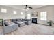 Comfortable living room featuring a large sectional sofa and cozy fireplace at 505 Silers Bald Dr, Fort Mill, SC 29715