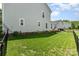 A spacious backyard with a manicured lawn and a black fence offers a private outdoor space at 6029 Phyliss Ln, Mint Hill, NC 28227