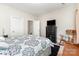 Cozy bedroom featuring a black dresser, a rocking chair, and two entry door at 6029 Phyliss Ln, Mint Hill, NC 28227