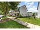 Street view showcasing the home's facade, landscaping, and well-maintained lawn at 6029 Phyliss Ln, Mint Hill, NC 28227