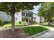 View of the home's exterior with a well-kept lawn, sidewalk, and charming front porch at 6029 Phyliss Ln, Mint Hill, NC 28227