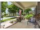 Front porch showcasing a seating area, plants, and views of the street at 6029 Phyliss Ln, Mint Hill, NC 28227