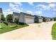 Street view highlighting the garages of well-maintained homes with manicured lawns at 6029 Phyliss Ln, Mint Hill, NC 28227