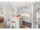 Kitchen with stainless appliances, gray cabinets, tile backsplash, and a spacious island with seating at 6029 Phyliss Ln, Mint Hill, NC 28227