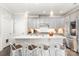 Well-lit kitchen featuring a large island with barstool seating and pendant lighting, with stainless appliances at 6029 Phyliss Ln, Mint Hill, NC 28227